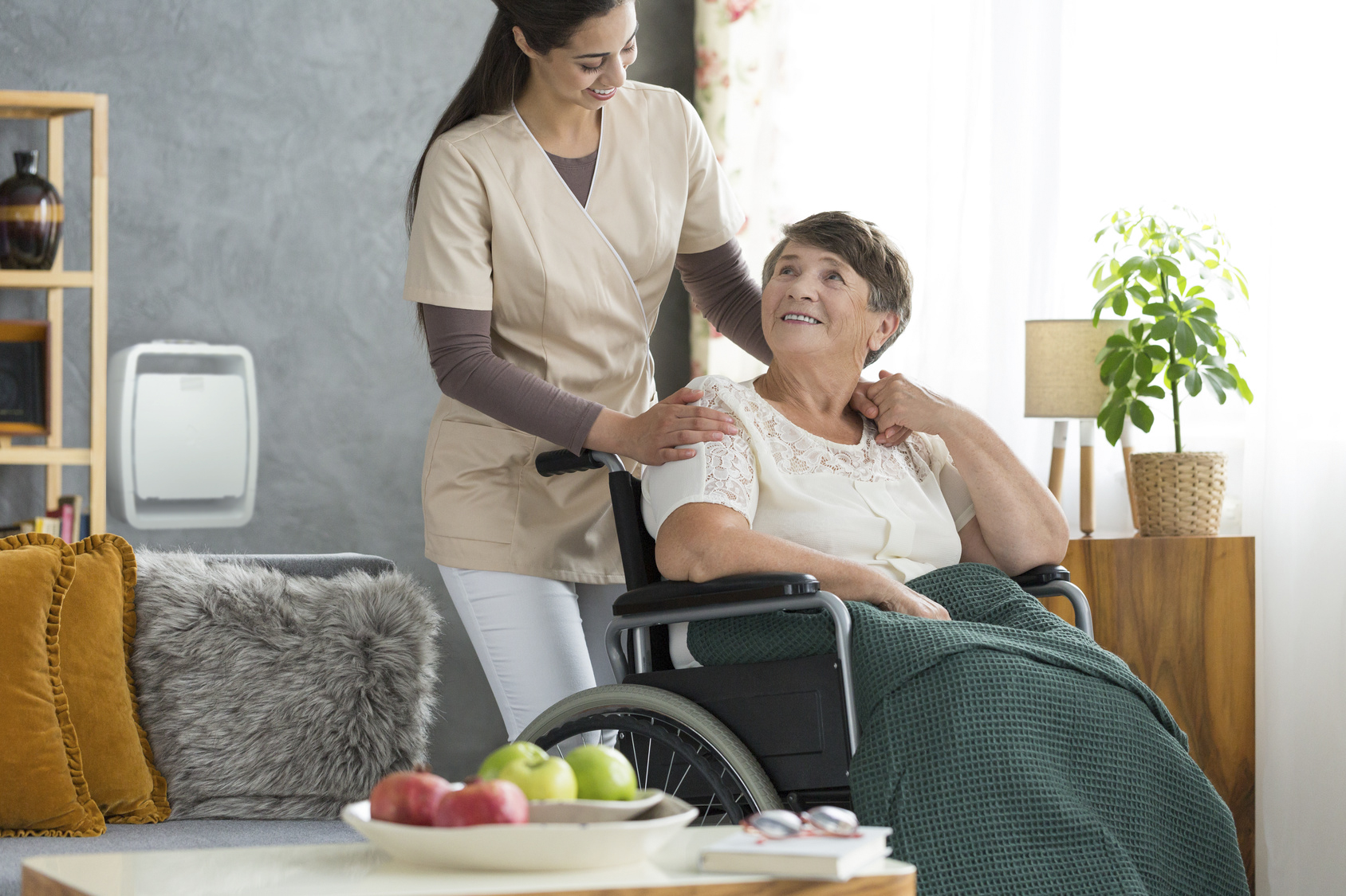 Young medical school intern visiting her elder patient at home after surgery